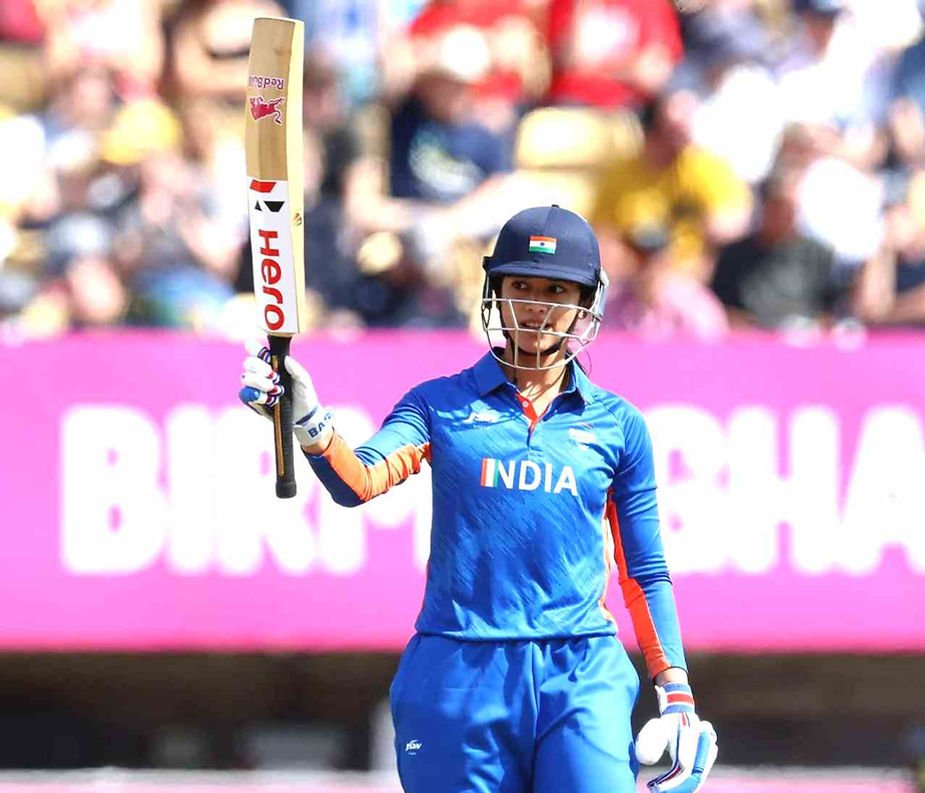 CWG 2022, Semi-final, England Women vs India Women, Top Performances_ Smriti Mandhana raises her bat as she scores fifty against England in CWG 2022 semi-final (Source_ ©AFP_Getty Images)